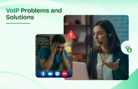 Man and woman wearing headsets looking at a computer screen discussing VoIP problems and solutions