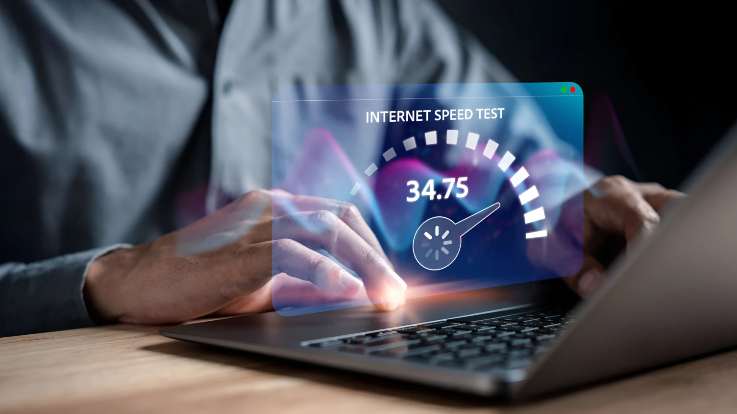 Person using a laptop with an VoIP speed test graphic showing 34.75 Mbps download speed