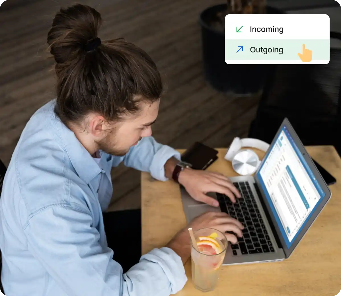 A man typing on a laptop with a pop-up menu showing "Incoming" and "Outgoing" options.